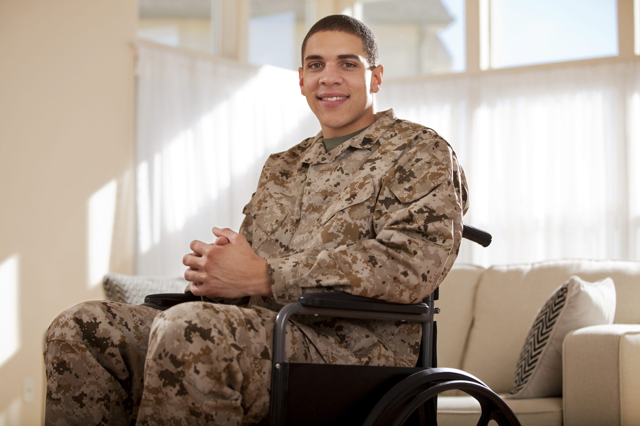 Disabled Veteran US Marine Soldier in Wheelchair. The model is wearing an official US Marine Corps Marpat digital BDU uniform.